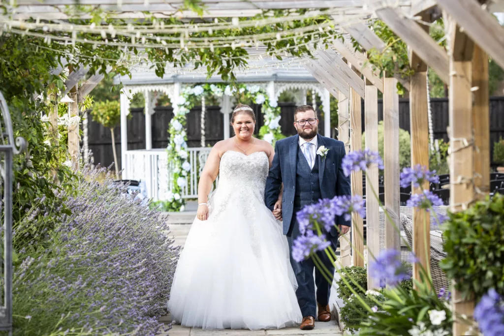 Stunning Kent wedding photography showcasing the love and joy of the newlyweds on their special day at the charming barnyard venue."