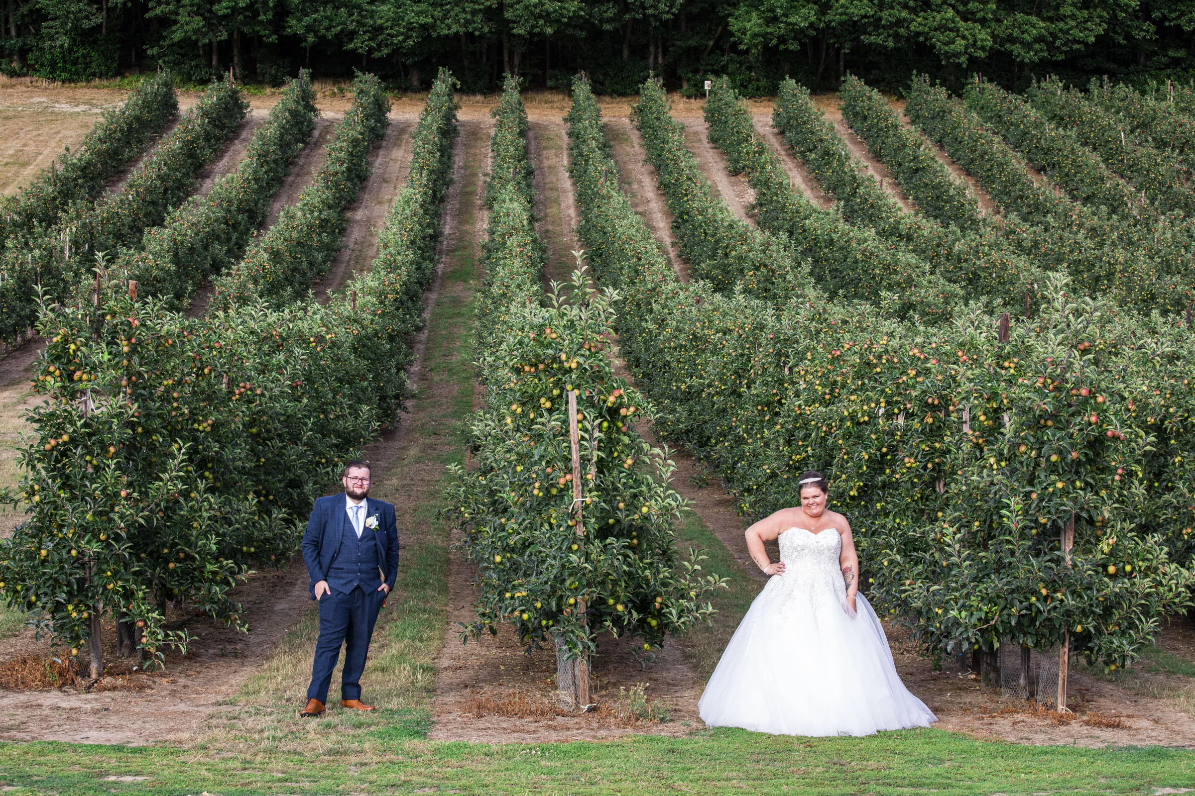 Gorgeous Kent wedding photography featuring the bride and groom surrounded by the natural beauty of the barnyard."